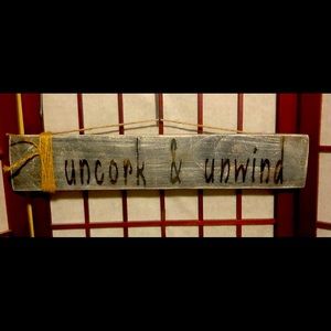 Wooden sign. Uncork & Unwind